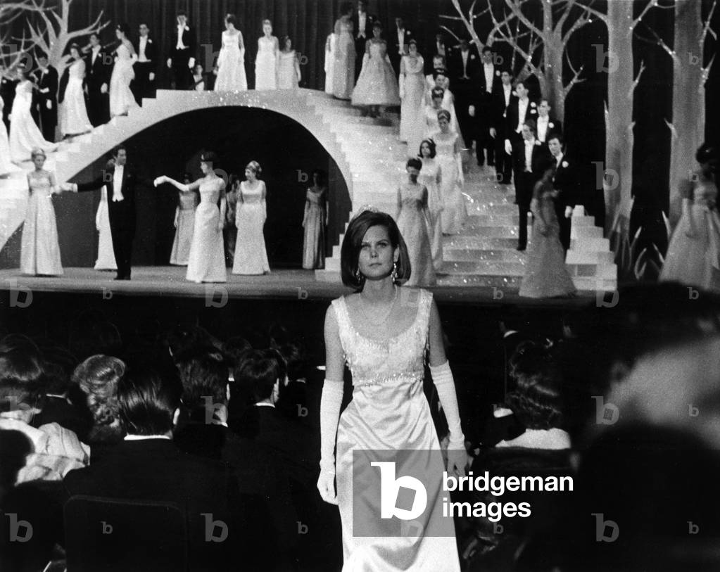 Ball of The Debutantes in Chaillot Palace in Paris on November 20, 1963 : Jacques Chazot (Master of Ceremony) With 2 Debutantes Under The Staircase (b/w photo)