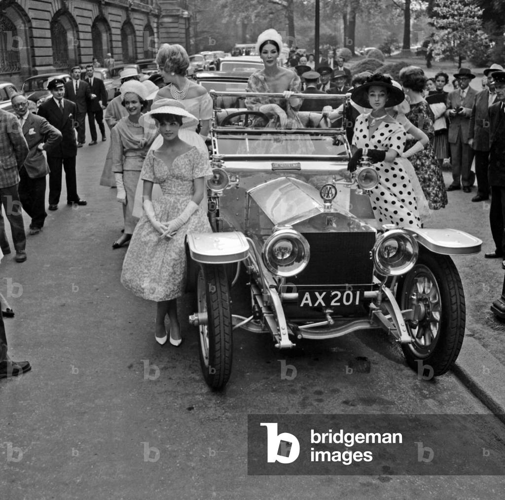 Defile From Rolls-Royce Sur Les Champs-Elysees In Paris May 12, 1959 Here Entered By Cortege Surrounded By Models The “Fantome D'Argent” Neg: A75822 (b/w photo)
