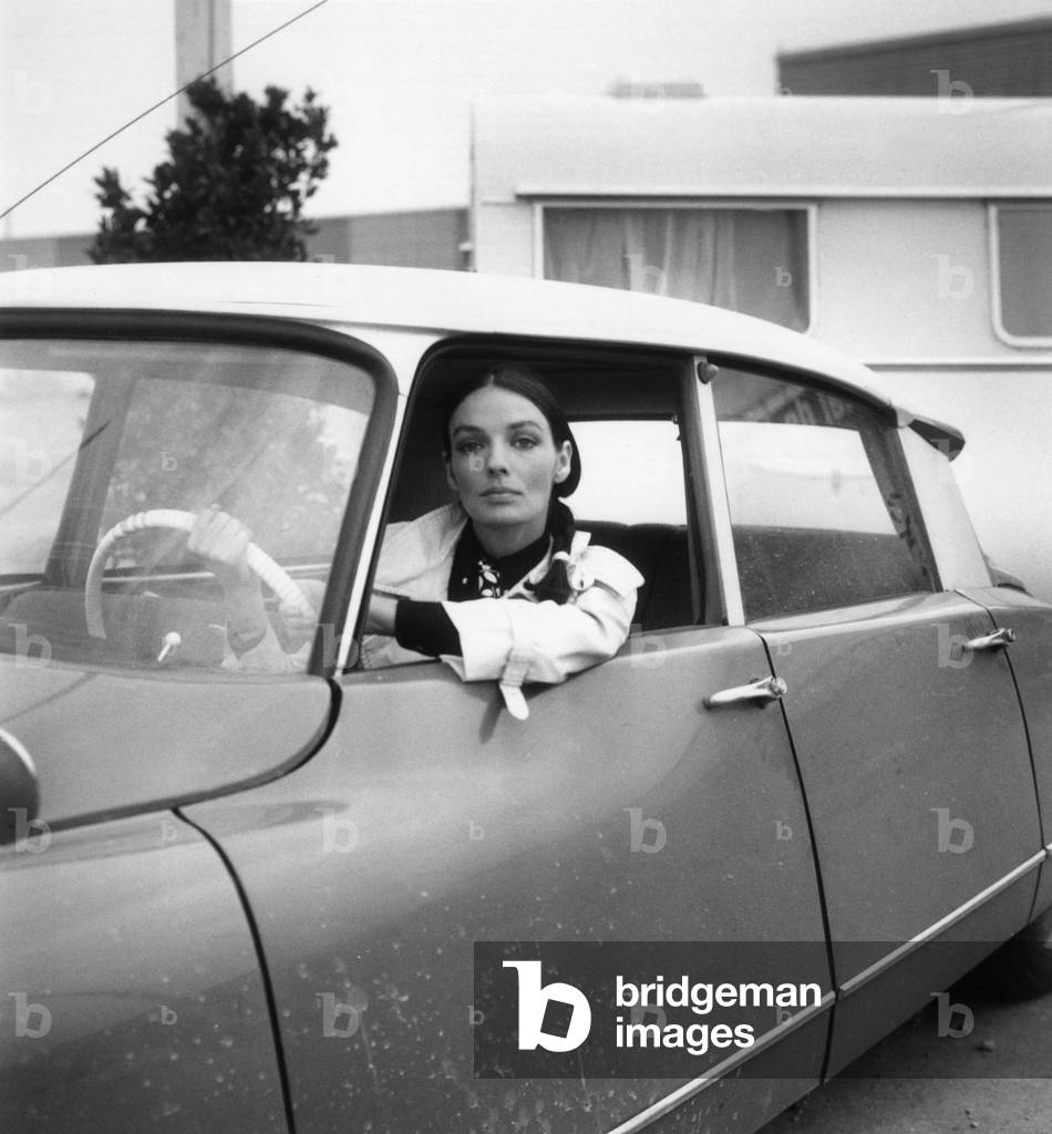 Marie Laforet Driving A Citroen Ds during Caravan Show in Le Bourget, France, March 5, 1966 (b/w photo)