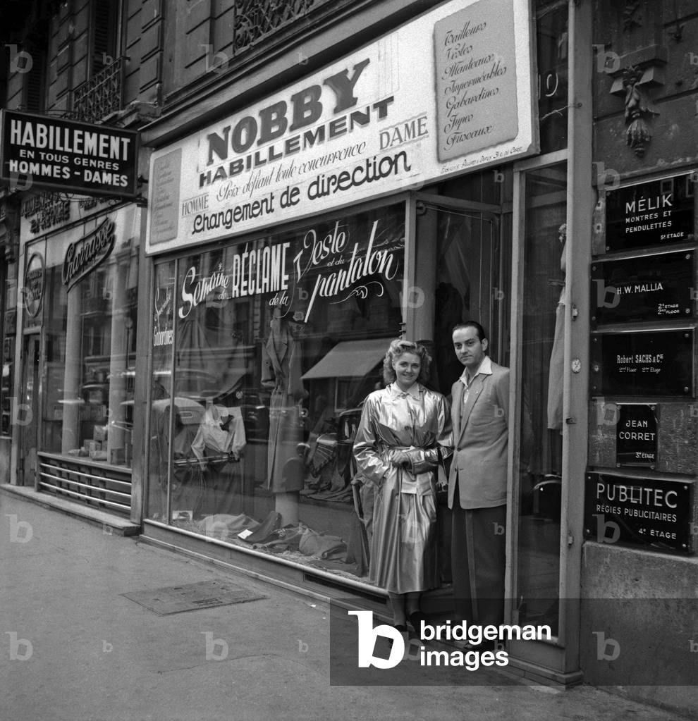 Nobby Habillement, clothes shop, Paris, 1949 : Isidore Cohen and a client