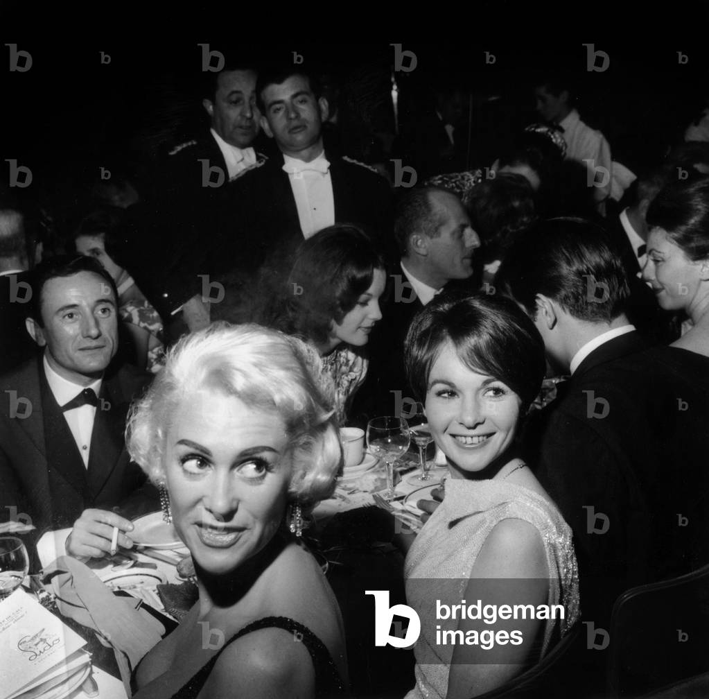 French Dress Designer Guy Laroche With Martine Carol and Francoise Arnoul on December 10, 1959 (b/w photo)