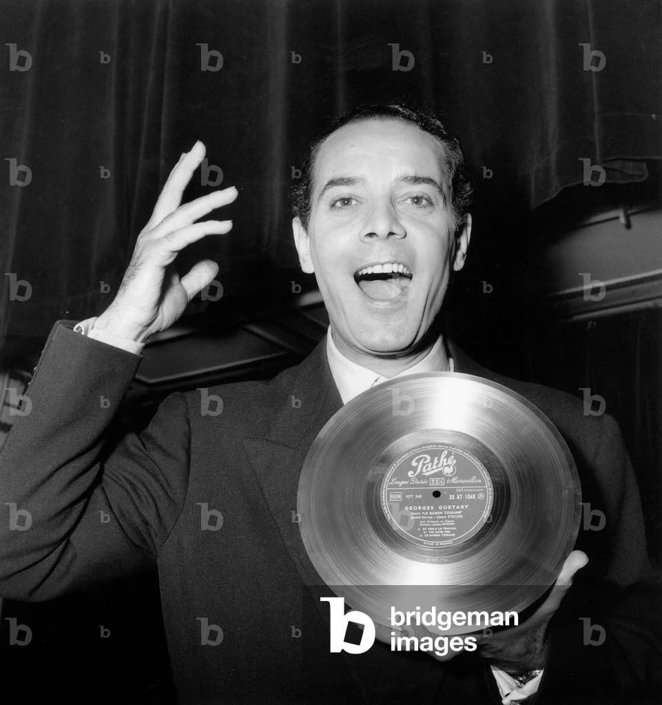 French Singer Georges Guetary Showing his Record With Song 