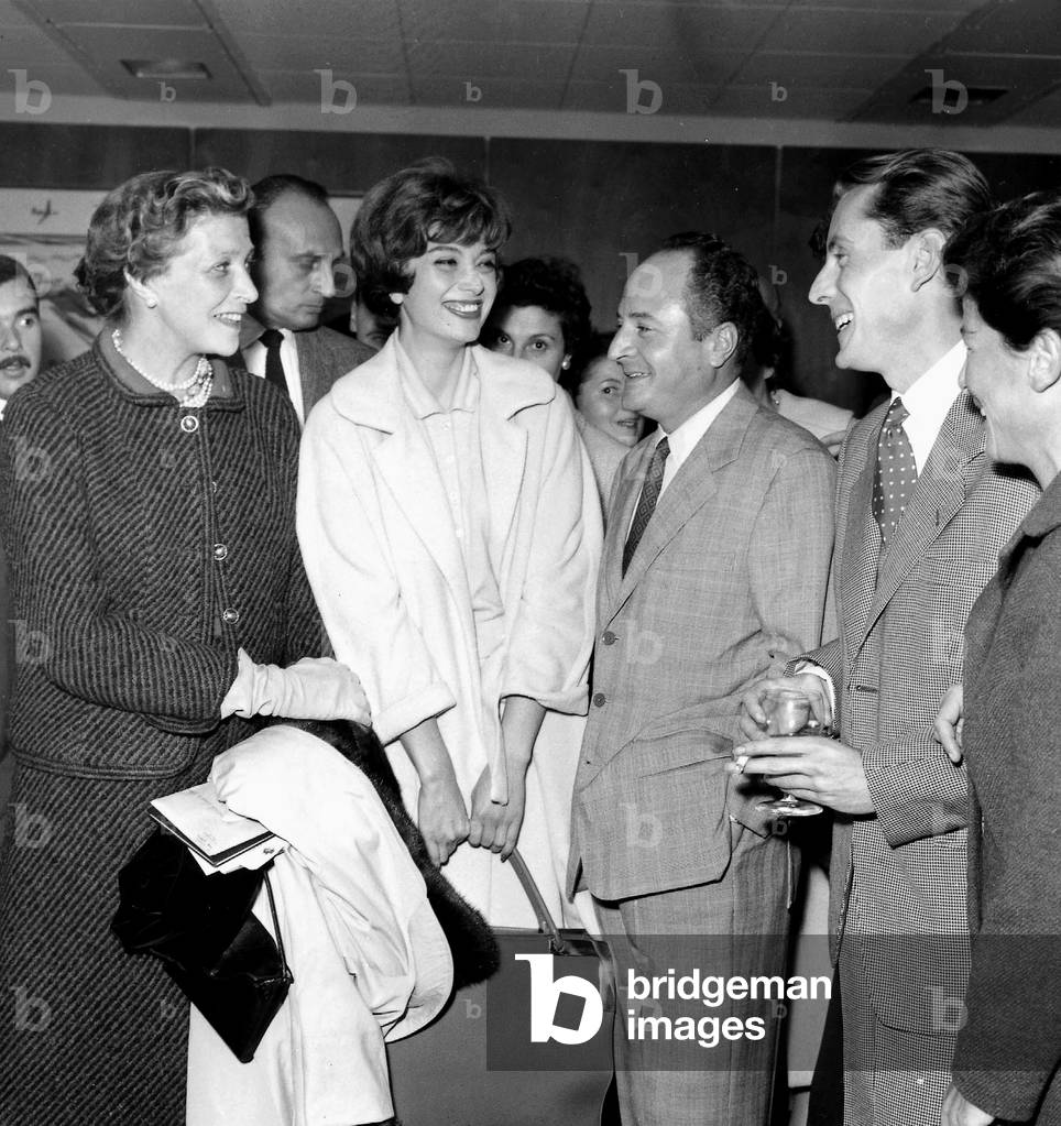 French Painter Bernard Buffet at Orly Airport For Departure For Texas With L-R : Louise De Vilmorin, Model Marie-Helene Arnaud, Pierre Daminos, Bernard Buffet and Lisette Pariente on October 13, 1957 (b/w photo)
