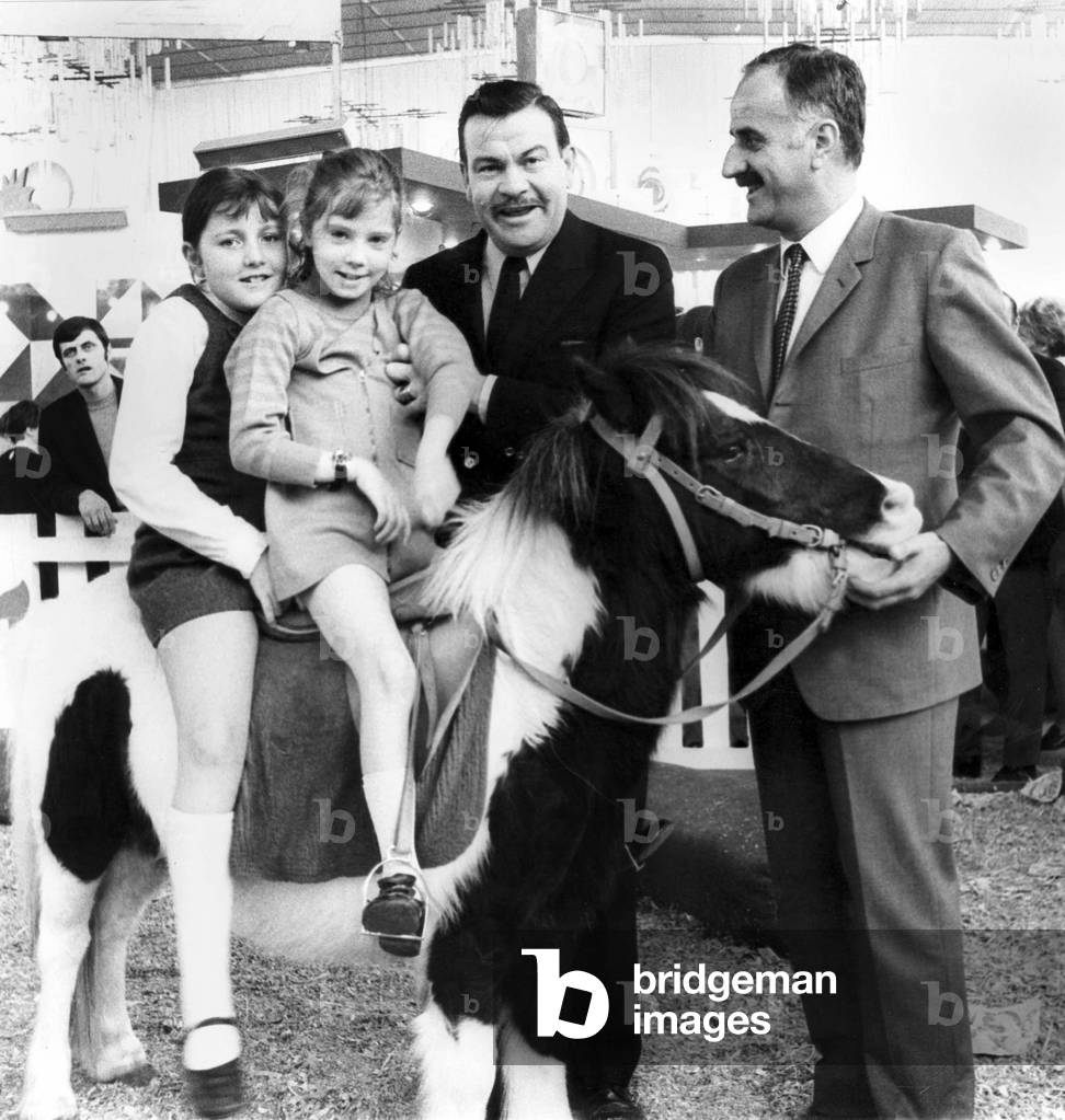 Jacques Baumel, French Secretary of State, and his Daughters Barbara and Bettina on A Pony, at Childhood Fair on November 1, 1969 (b/w photo)