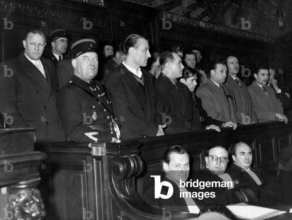 Pierre Caro (Near Gendarme) With his Accomplices during Trial January 19, 1953 (b/w photo)