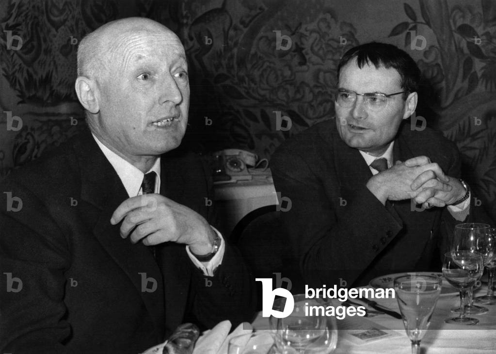 Armand Slacrou And Rene Bazin Member of the Jury of the “Goncourt Prize” Meeting During A Breakfast At Drouant To Talk About The Award On November 26, 1958 (b/w photo)
