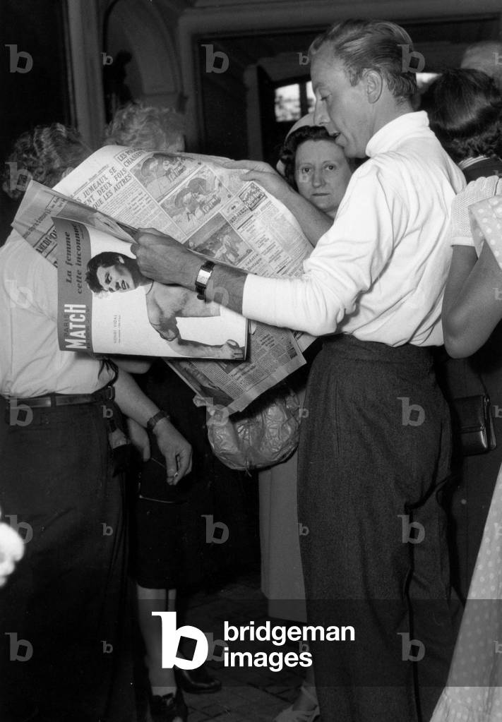 French Dress Designer Jacques Fath at his Fashion House Preparing New Collection August 1949 Reading Paper (b/w photo)