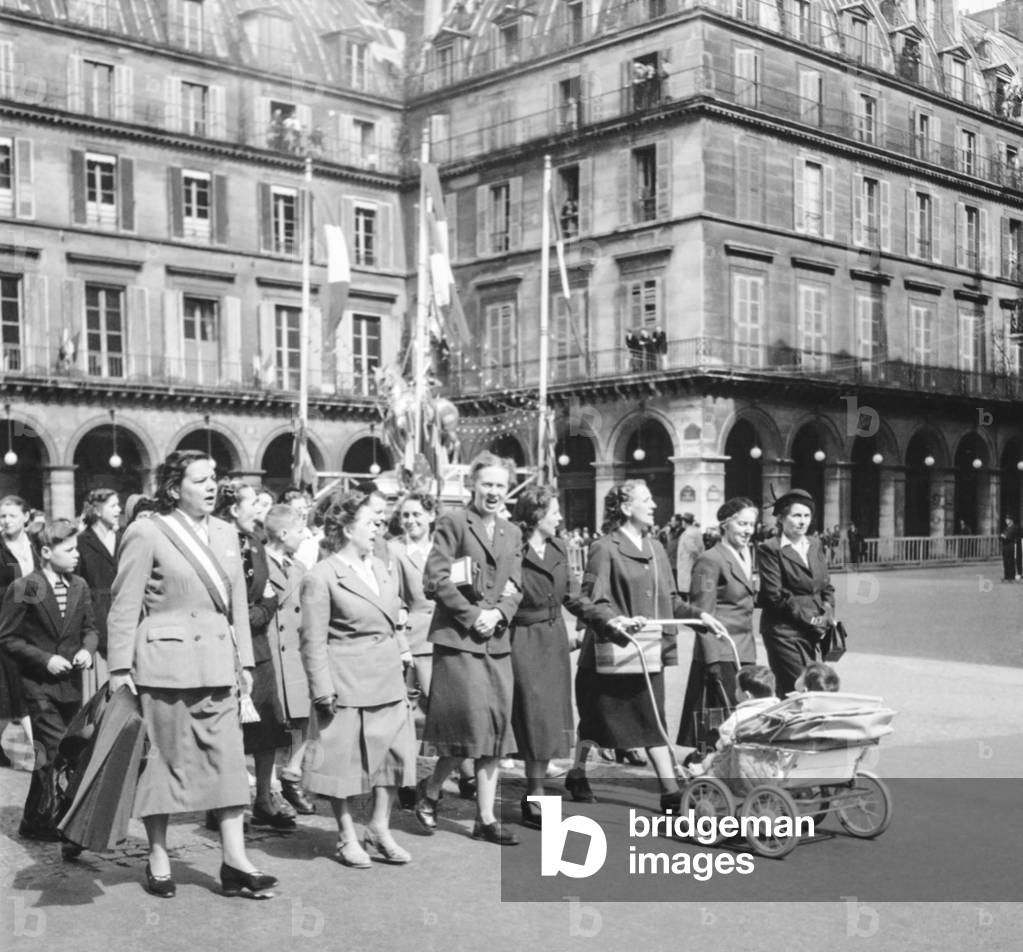 Celebration of Joan of Arc in Paris on May 6, 1951 : Marie Claude Vaillant , Francoise Leclercq (pram) (b/w photo)