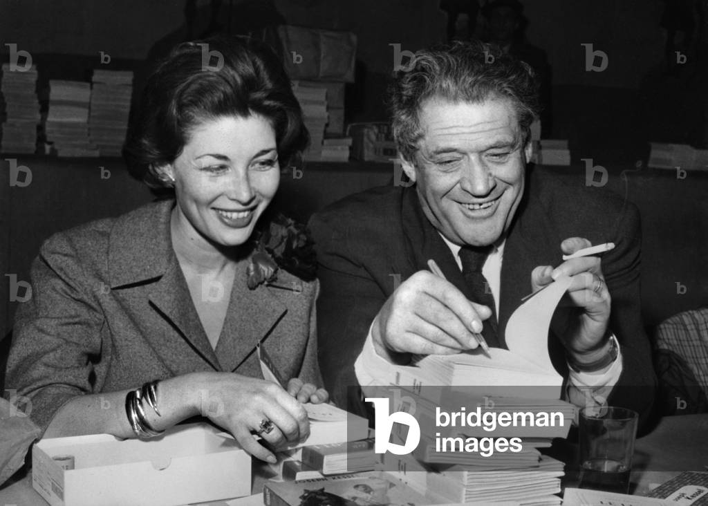 Lise Bourdin and Joseph Kessel Signing Books For The Comite National Des Ecrivains (Cne), Vel D'Hiv, Paris, France, April 11, 1959 (b/w photo)