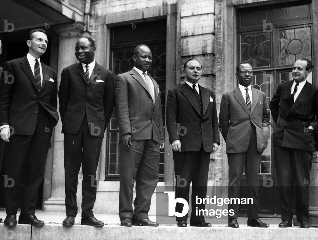 From Left to Right Mr Gilson (Belgian Minister of National Defense) Mr Yav (Former Minister of Economic Affairs of the Lumumba Government) Mr Kibwe (President of the Katangese Delegation Minister of Finance of the Katangese Government) Mr Eyskens (Belgian Prime Minister) Mr Masangu (Former Vice President of the Congolese Senat And Mr Scheyven (Minister Responsible for Economic Affairs Of Congo And Ruanda Urundi August 1, 1960 At Domaine De Val Duchesse (b/w photo)