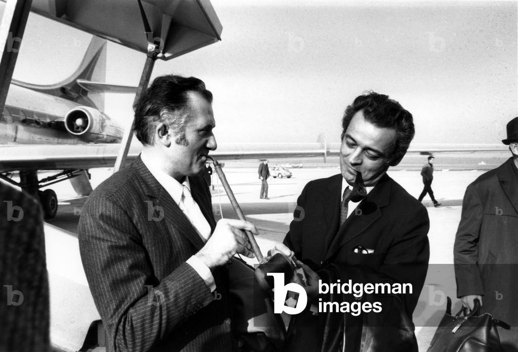 The frencha ctor Jean Richard and the french journalist Pierre Sabbagh at the airport of Geneva, on November 27th, 1968 (b/w photo)