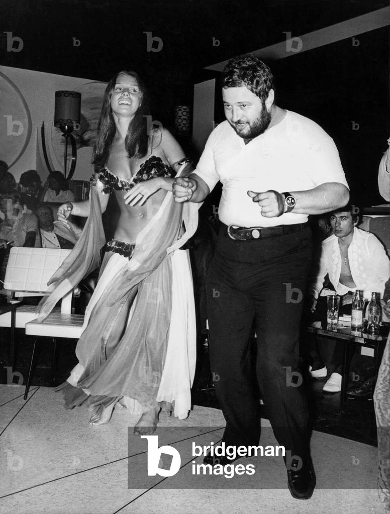 Beatrice Barclay (Wife of The Frenchproducer) and Singer Carlos Doing Belly Dancing at Opening of Nightclub in Cannes July 4, 1970 (b/w photo)