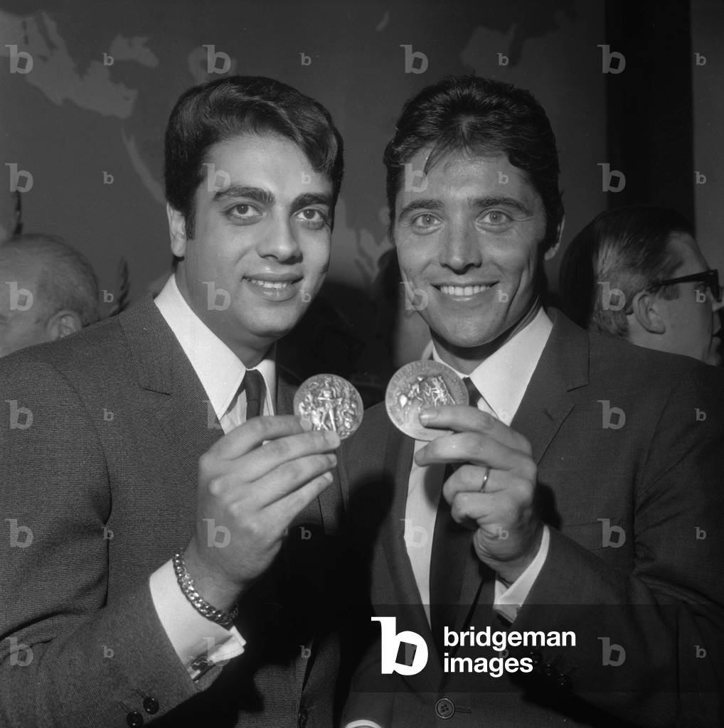 French singers Enrico Macias and Sacha Distel receiving their SACEM's medals, on April 28,1966