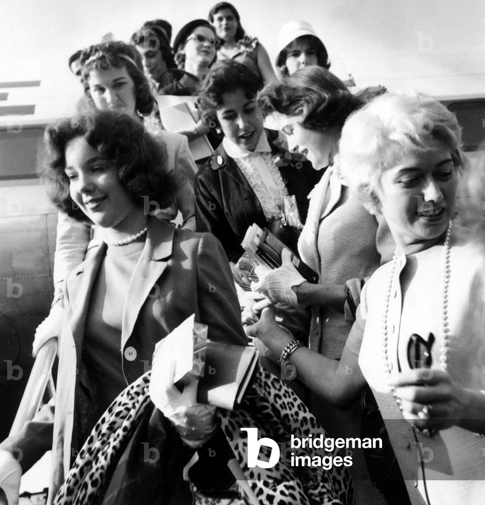 On July 10, 1958, American Debutants Arriving in France For Ball Which Will Take Place in Versailles. on L : Joanne Hearst (Granddaughter of Williamrandolfhearst) (b/w photo)