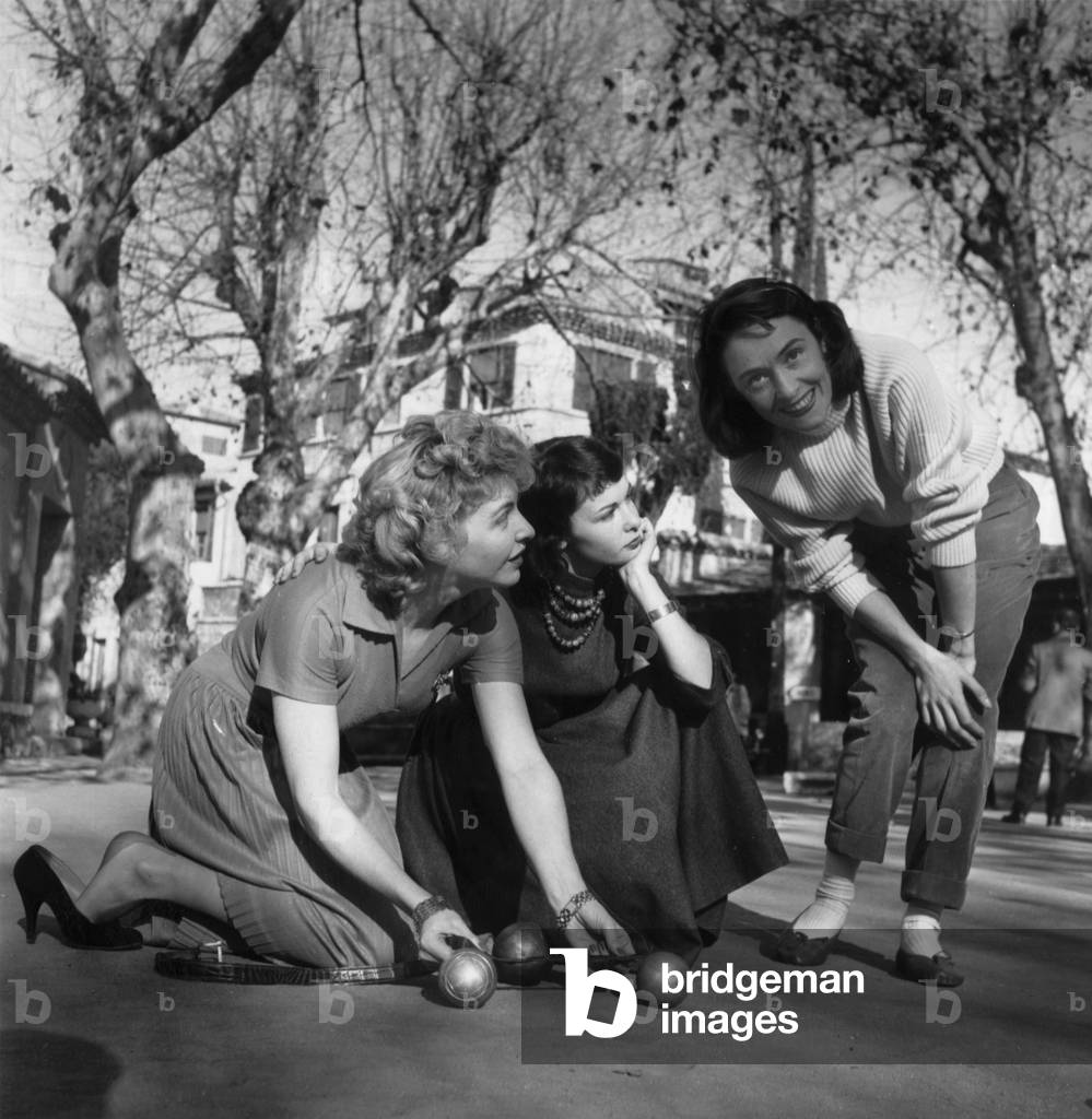 French Stars Line Renaud, Francoise Arnoul and Maria Mauban Are Playing Boules in Saint Paul De Vence on January 10, 1956 (b/w photo)