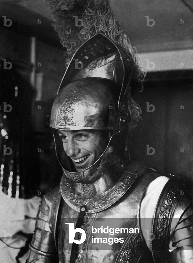  French actor Jean Paul Belmondo trying on his armour on set of film 