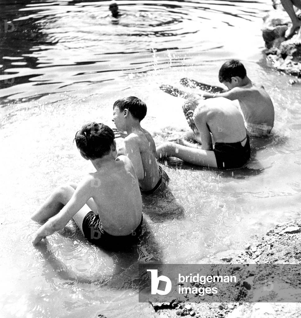 Heat in Paris July 18, 1945 : Children Having A Swim (b/w photo)
