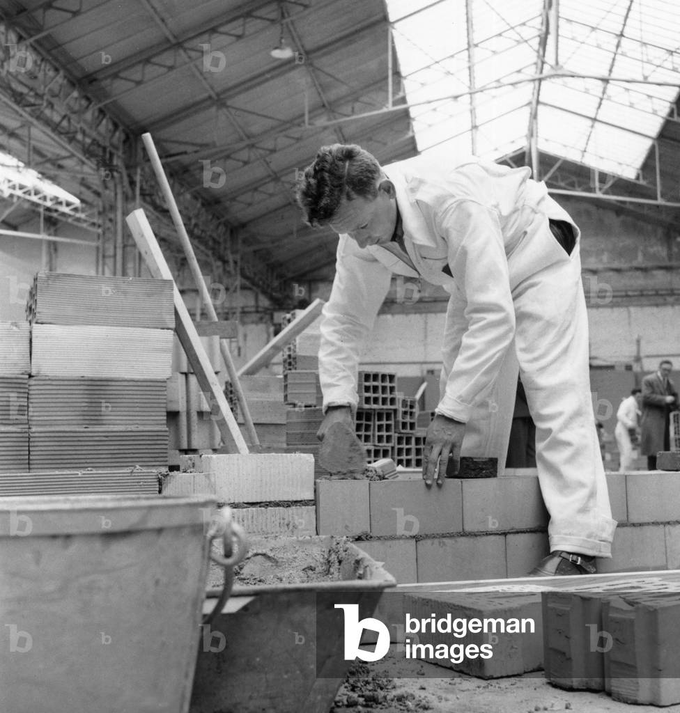 Silver Trowel Making a Small Wall in Paris June 19th 1956 (b/w photo)