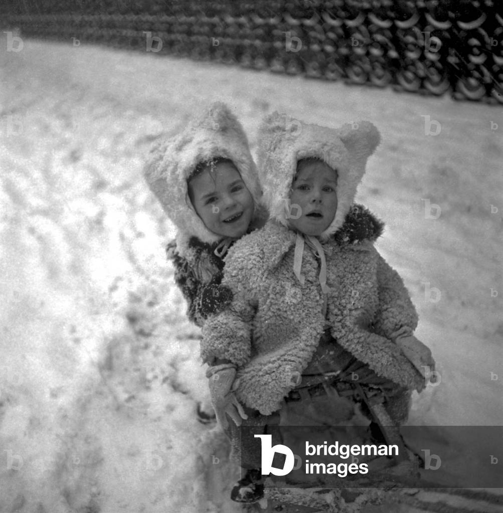 Girls on A Sled in The Snow, Paris, February 22, 1948 (b/w photo)