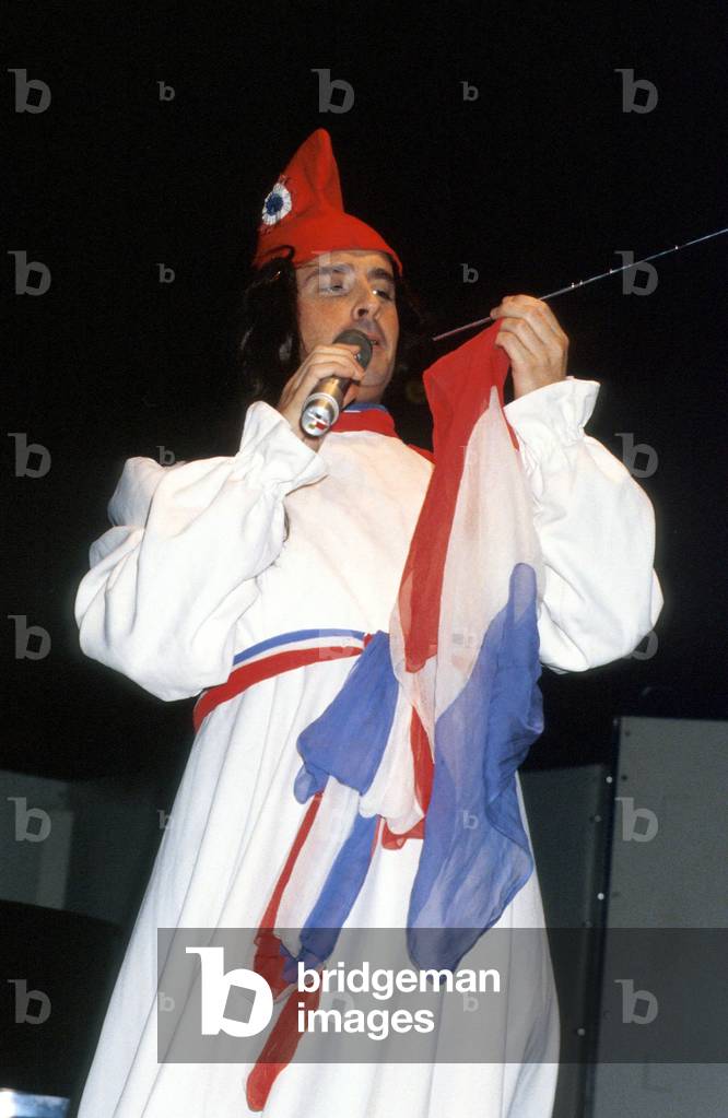 Thierry Le Luron French Humorist here during Impression of French Actress Alice Sapritch on Stage October 1979  (photo)