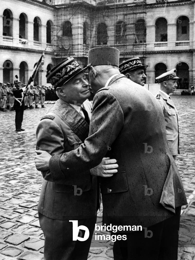 General De Gaulle Decorant 3 Generals: On the Right The General Dodelier, The General Dio (Kissing By De Daulle) And On the Left The General Accard In The Court Of Honour Of The Invalides July 22, 1965 (b/w photo)