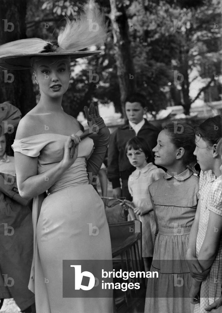 Mylene Demongeot Wears A Decolletee Dress And A Great Eigrettes Capeline On June 9, 1958 (b/w photo)