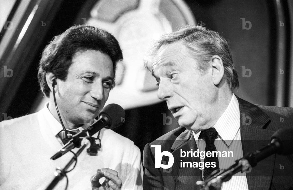 Michel Drucker  and French actor Yves Montand during radio program 