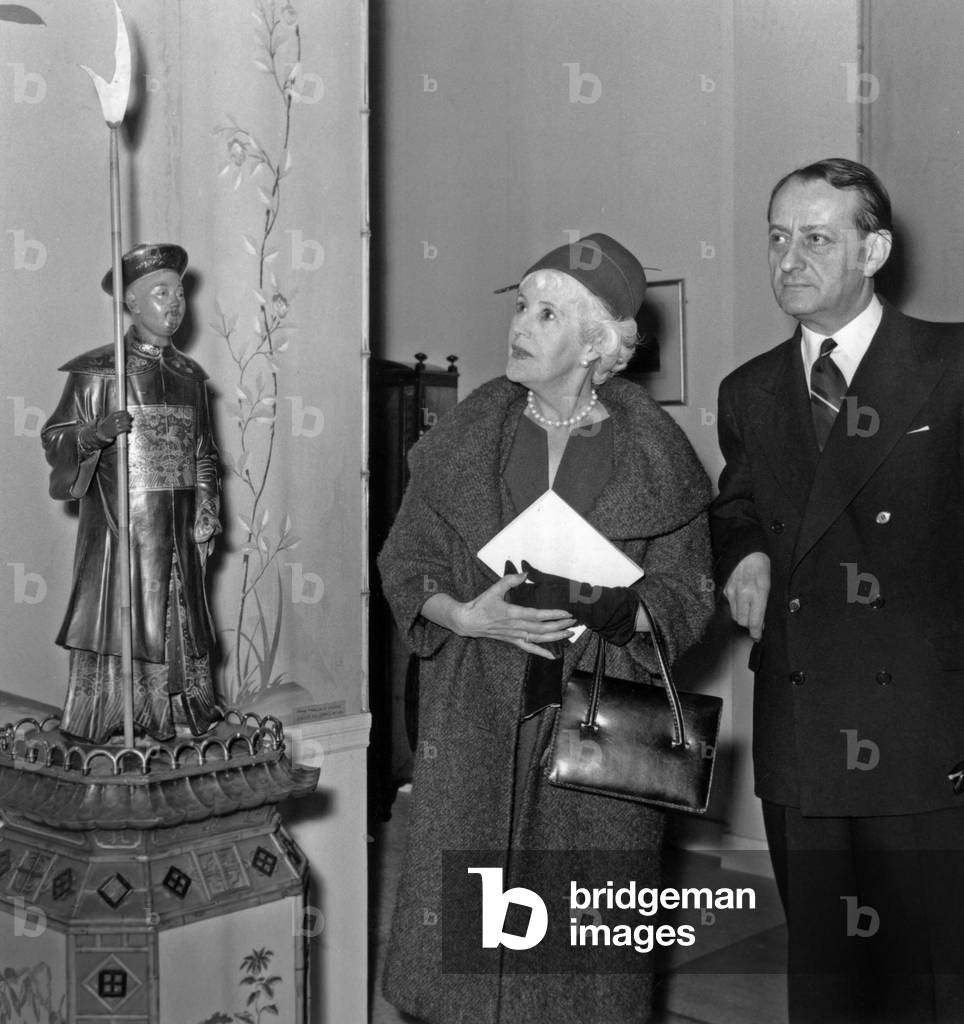 Andre Malraux, French Minister of Culture, and Lady Jebb (Wife of English Ambassador in France), Visiting An Exhibition in Paris, February 25, 1959 (b/w photo)