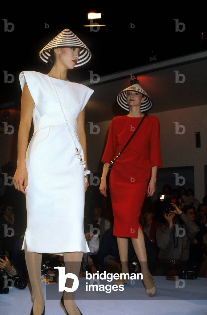 Pierre Cardin Fashion For Summer 1985 : Red and White Dresses With Striped Cone-Shaped Hats (photo)