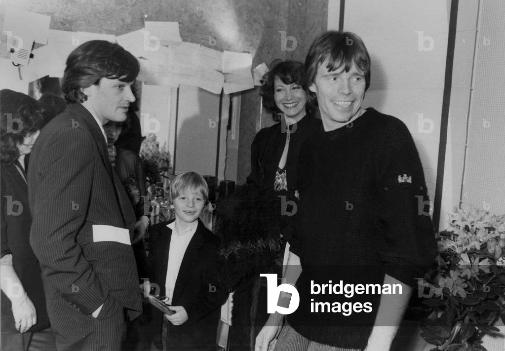 French Singer Pierre Bachelet in his Dreesing Room at The Olympia With his Wife and his Son Quentin on February 16, 1984 (b/w photo)