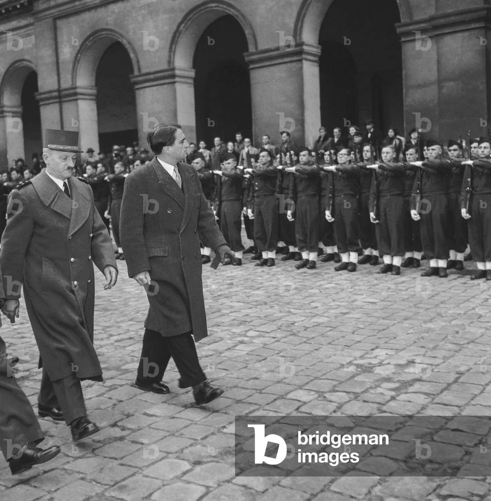 Christening of the new promotion of Saint-Cyr Coetquidan military school, at the Invalides, Paris, December 5, 1949 : Max Lejeune and General Chateau (b/w photo)