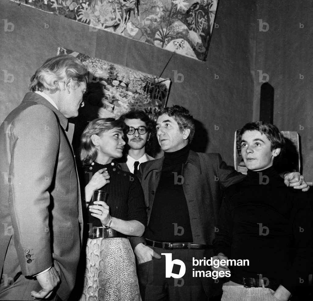 Daniele Delorme and Daniel Gelin With Their Son Xavier Gelin (In The Background) and Martin Lartigue (R) The Son of Painter Dany Lartigue at Private View of Exhibition in his Workshop in Paris November 05, 1970  (b/w photo)