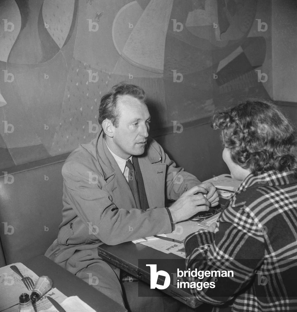 French actor Bourvil with a journalist, May 1950, Paris (b/w photo)