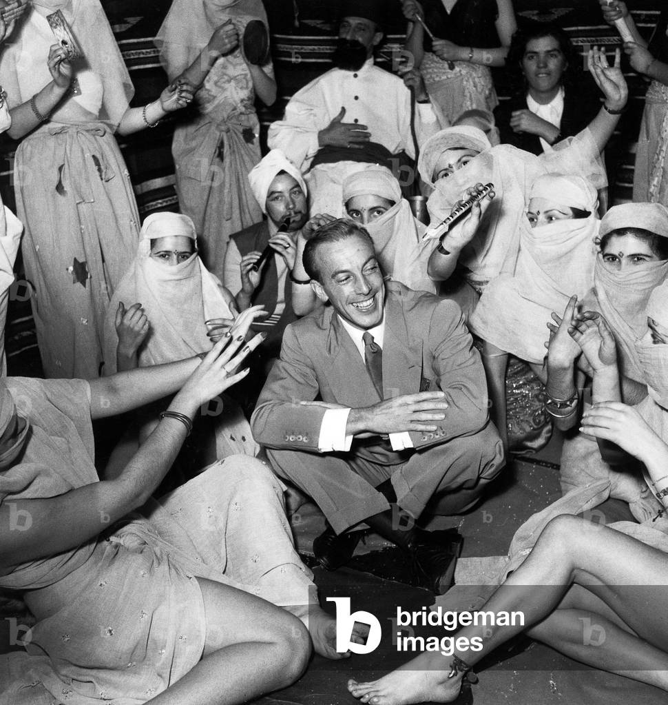 French Dress Designer Jacques Fath With Models during Party at his Home November 1950 For The Holiday Made For Women Who Reach 25 Years of Age Without Marrying Which Symbolized Their Spinsterhood  (b/w photo)