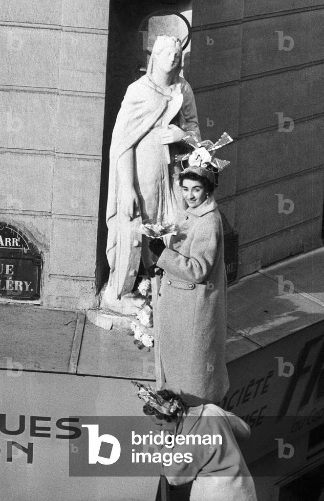 Catherinettes Putting Flowers at Statue of St Catherine in Paris, November 25, 1955 (b/w photo)