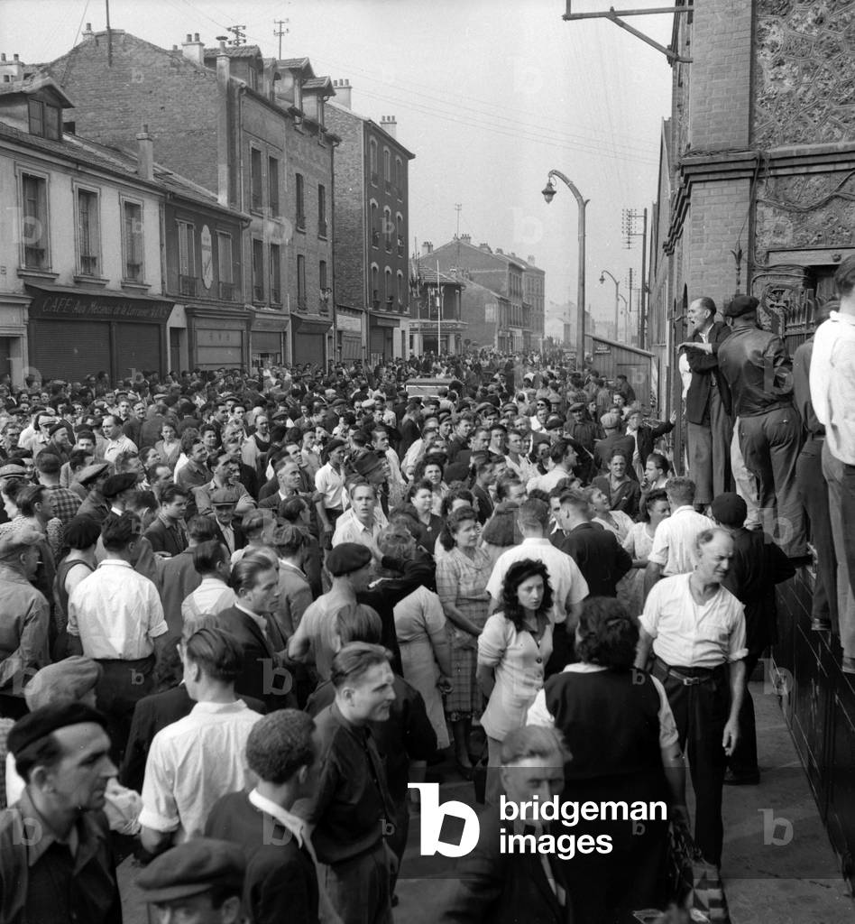 Demonstration outside the SNECMA plant in Argenteuil, France, on August 22, 1949 : workers want to keep their job (b/w photo)
