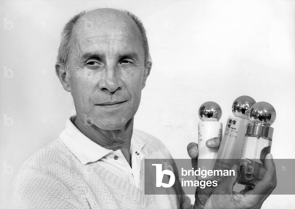 French Couturier Andre Courreges Presenting Cosmetics July 8, 1980 (b/w photo)