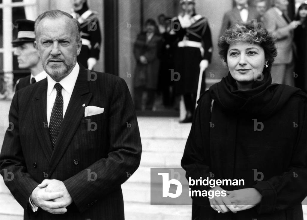 French Minister of Defence Charles Hernu and French Secretary of State For Defence Edwige Avice Leaving The Elysee Palace. Paris, France, January 3Rd 1985. (b/w photo)