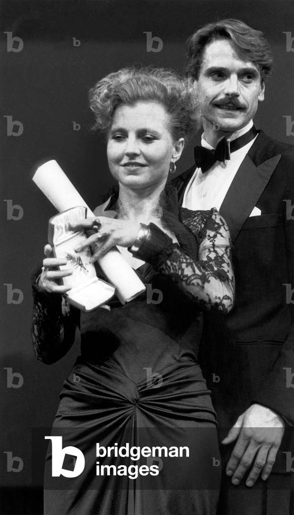 Honour List of The Cannes Film Festival : Hanna Schygulla Getting The Feminine Interpretation Prize For her Role in The Film Story of Piera, here With Jeremy Irons, on Mai 19, 1983  (b/w photo)