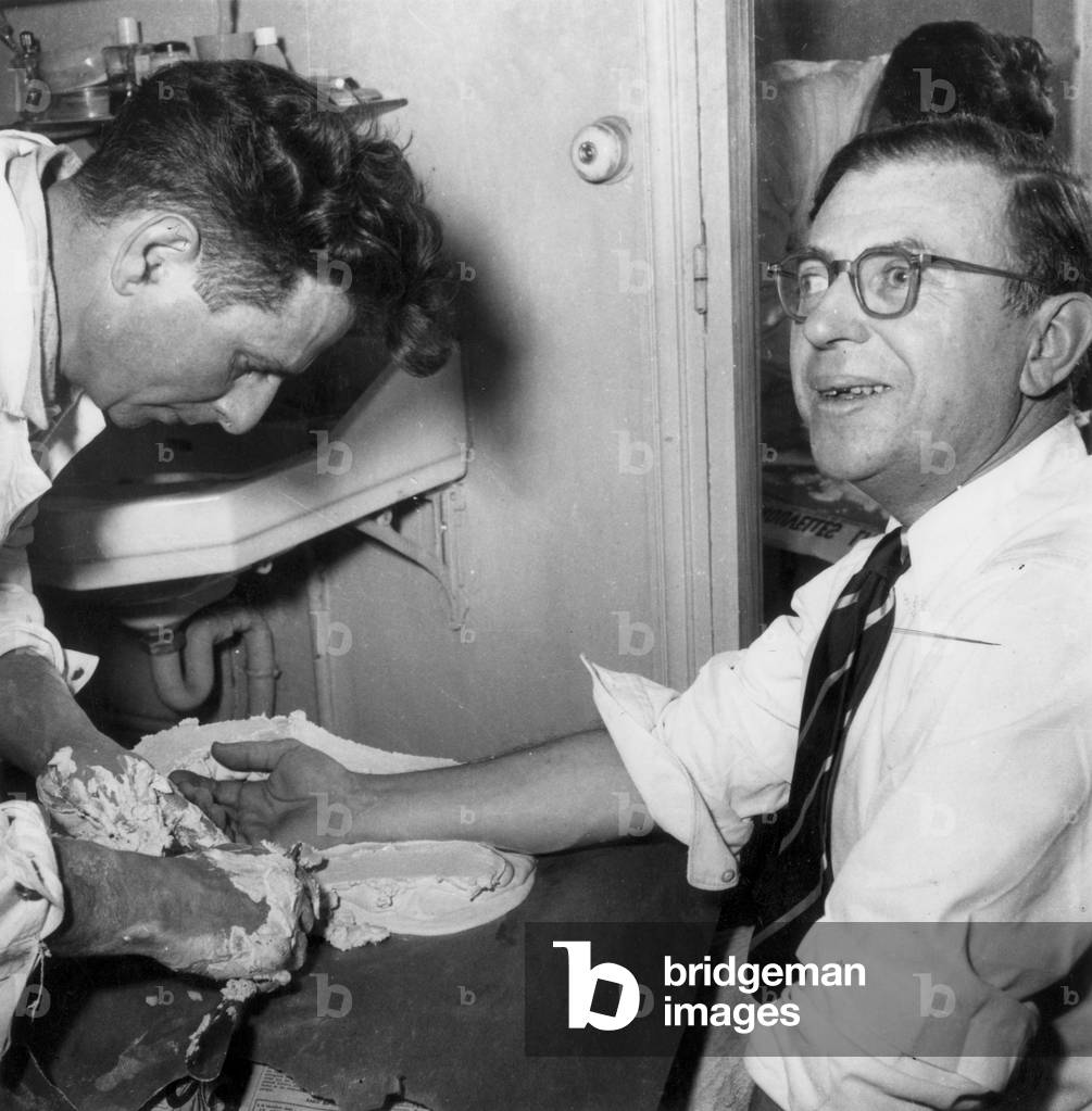 Jean Paul Sartre Takes A Cast of his Hand, August 1950 (b/w photo)