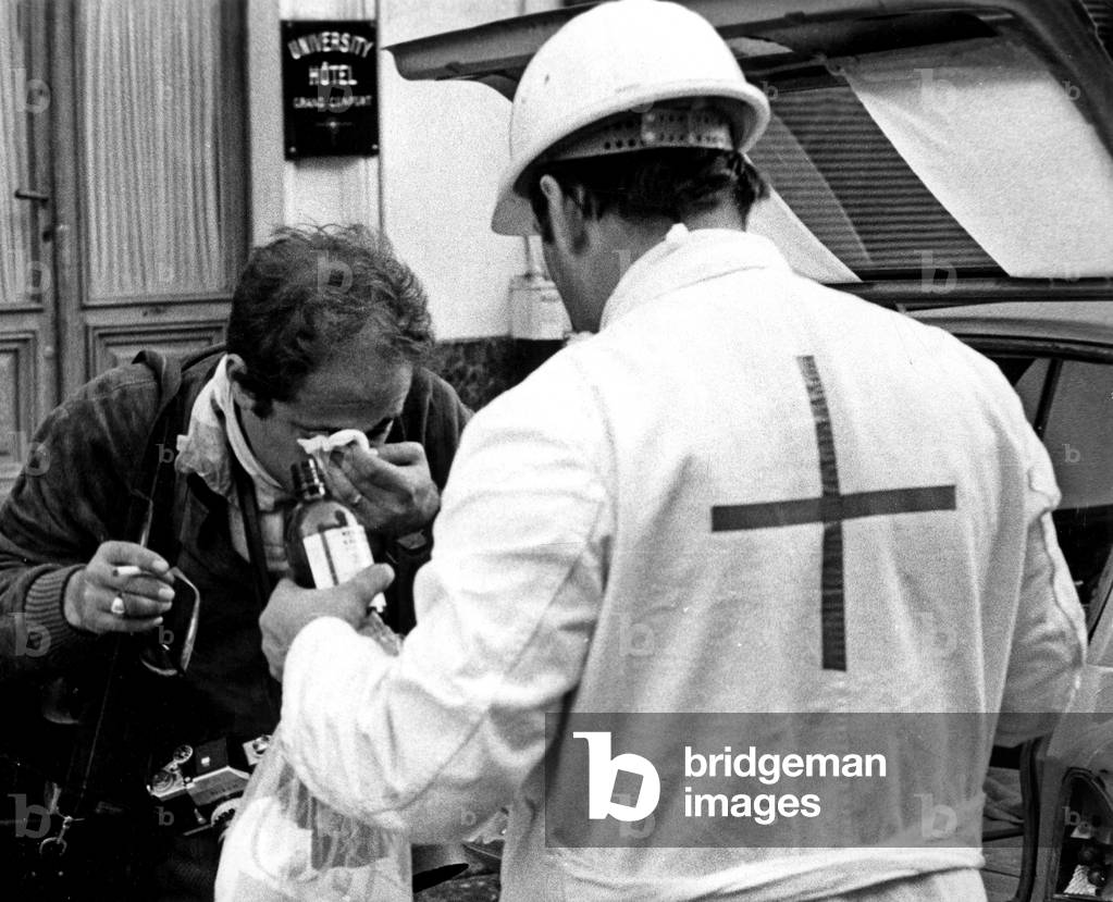 A Wounded Man Is Treated By A Member of Red Cross on June 11, 1968 After A Night of Riots, Paris (b/w photo)