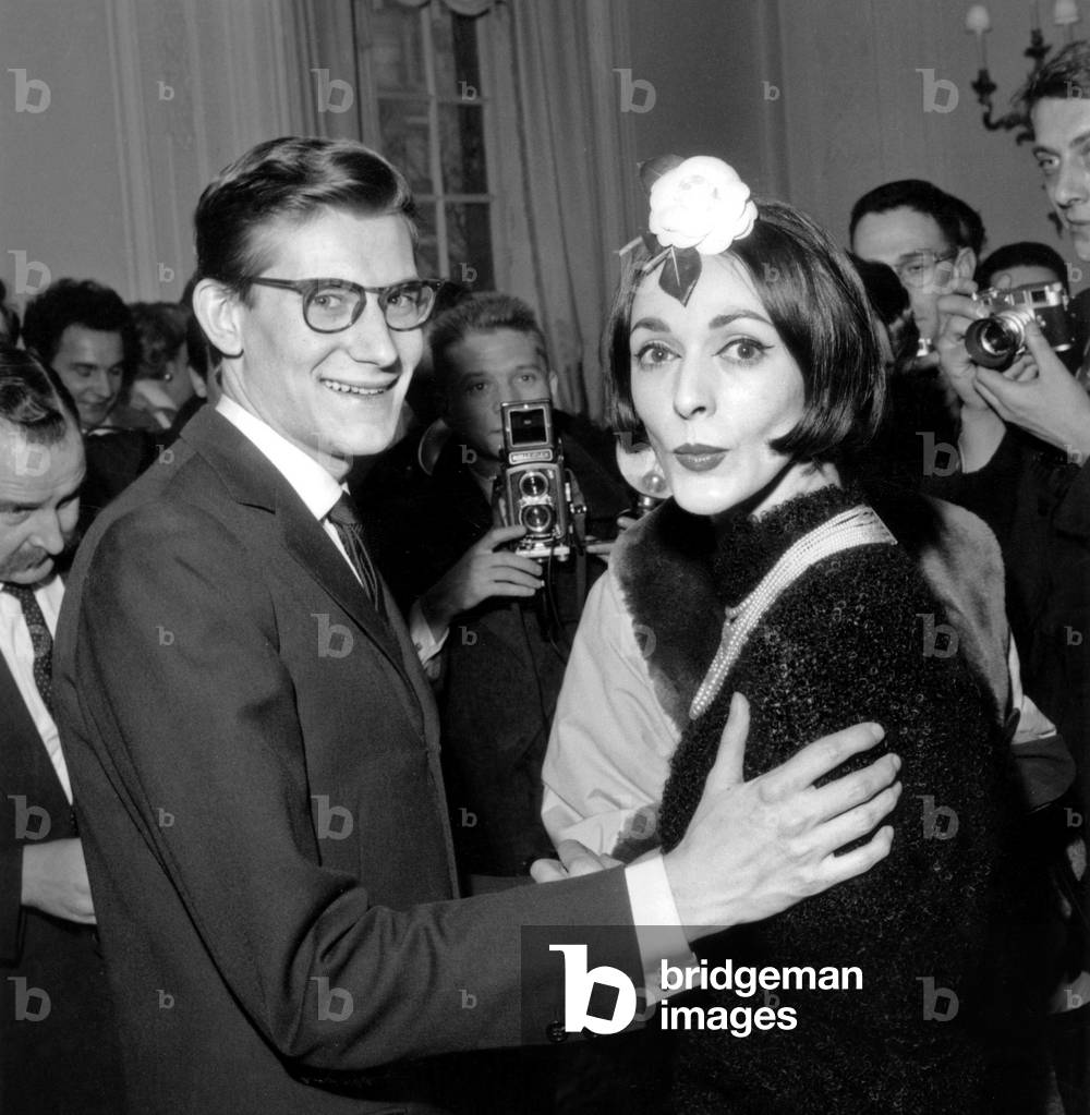 Yves Saint Laurent and his New Model Kouka during The Show Spring Collection of Christiandior on January 29, 1959 (b/w photo)