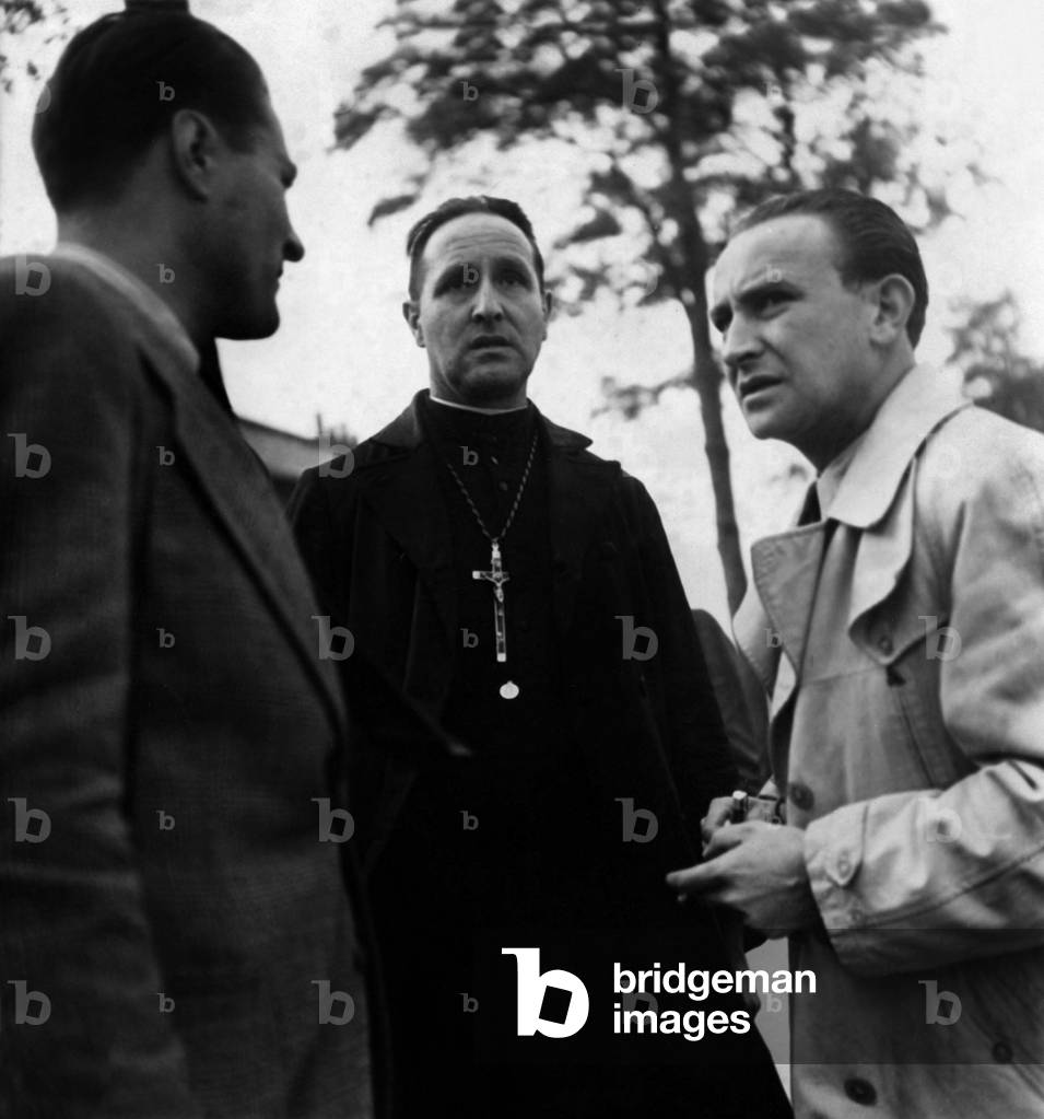 After Pierre Laval's Burial At Thiais Cemetery The Aumonier Who Confessa He Condemns Here Conversed With Journalists October 15, 1945 (b/w photo)