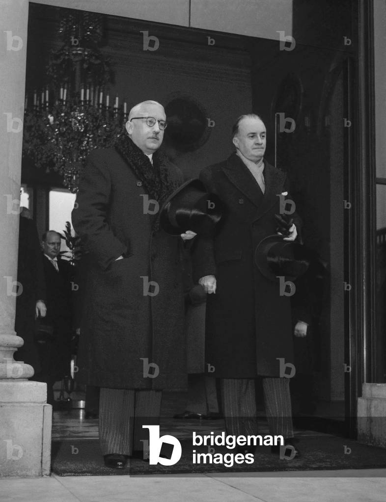 Pierre-Antoine de Salis (l) Swiss minister in France, in Paris, December 29, 1949 at the Elysee. On r : Jacques Dumaine (b/w photo)