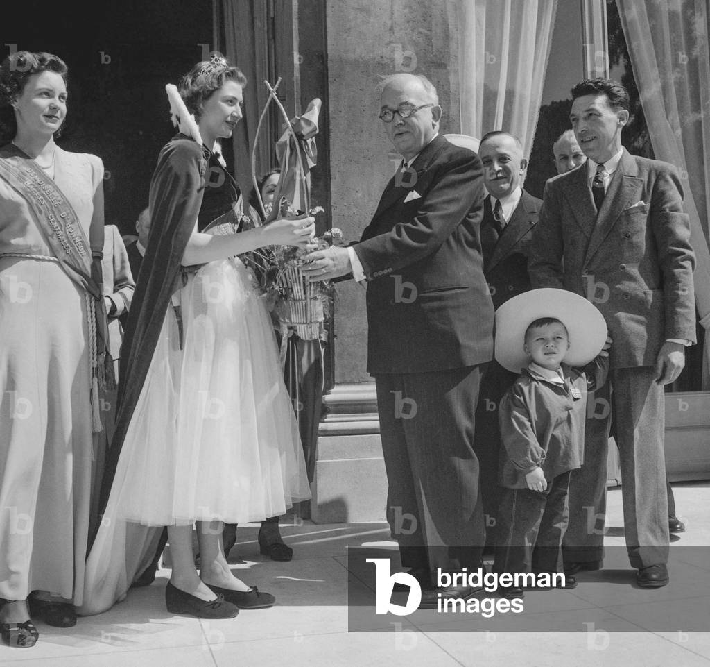 French president Vincent Auriol receiving the queen of the Halles at the Elysee, Paris, May 1st, 1950 (b/w photo)