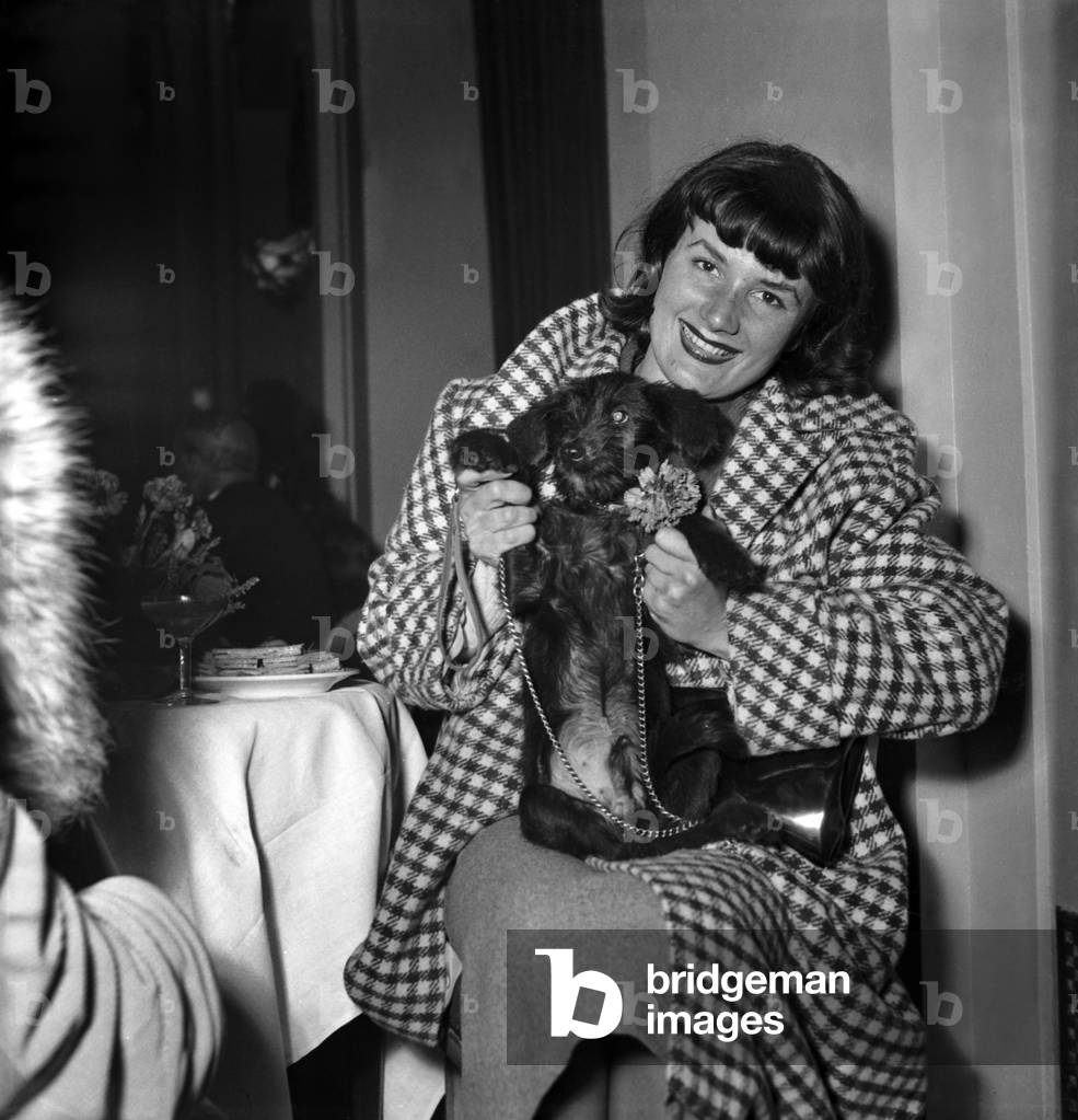 French Actress Jacqueline Pierreux With her Dog, Paris, October 20, 1948 (b/w photo)