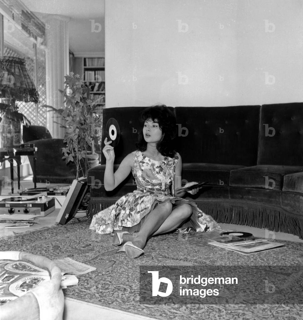 French Actress Dany Carrel Seated on Floor With Vinyls C. 1960 (b/w photo)