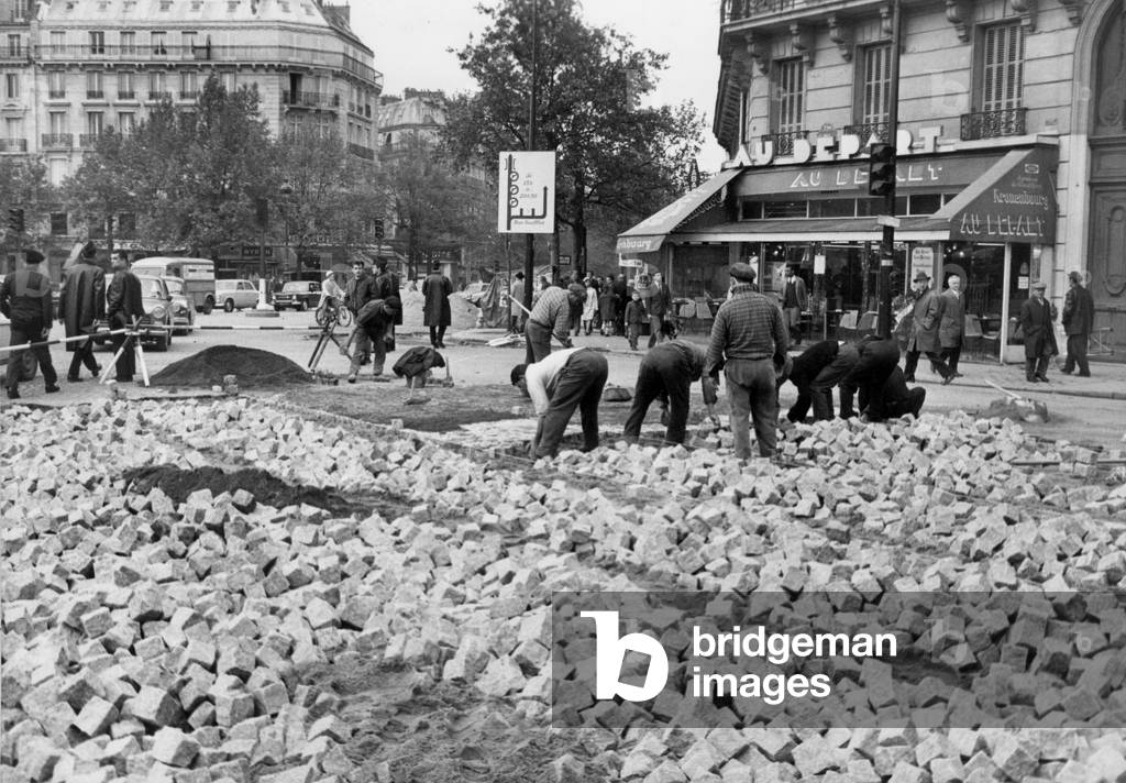 In Paris, Pavers Repairing Street May 11, 1968 (b/w photo)