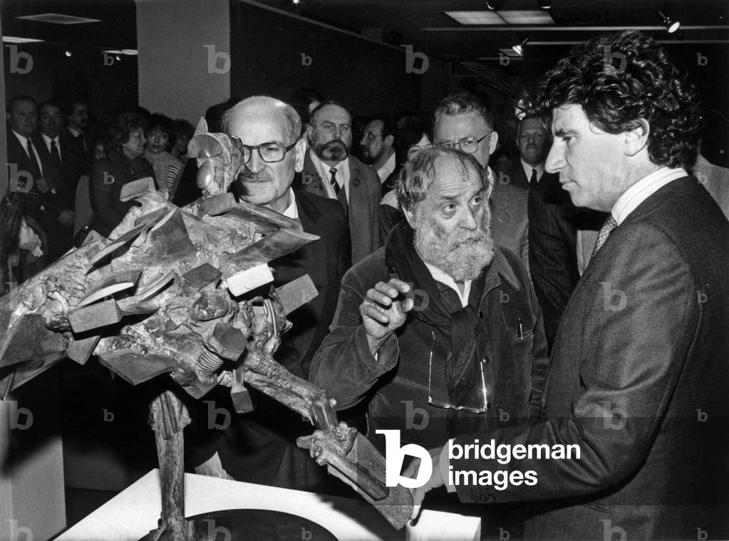 Cesar During the Inauguration of His Exhibition Dedicated Only To The Bronze Work Of The Sculteur In The Company Of Louis Mexandeau (Minister Of Ptt) And Jack Lang (Minister Delegate To Culture) February 2, 1984 (b/w photo)