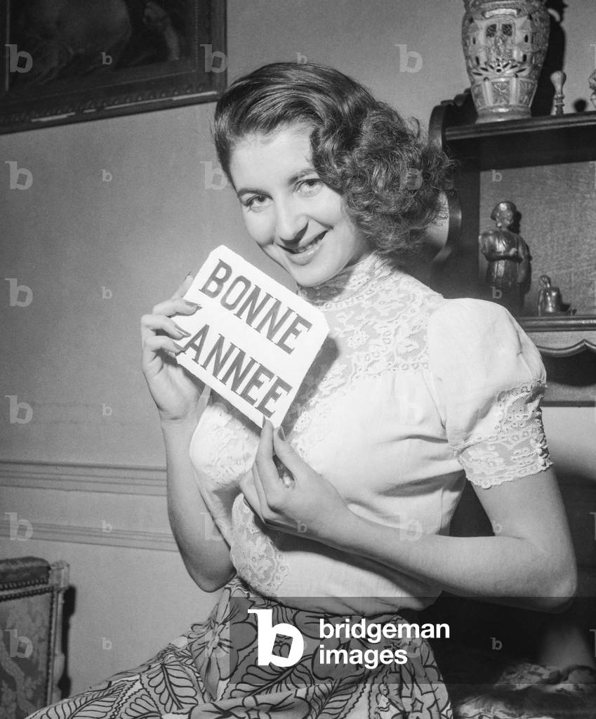 French actress Myriam Bru at home, celebrating the new year, Paris, December 29, 1950 (b/w photo)